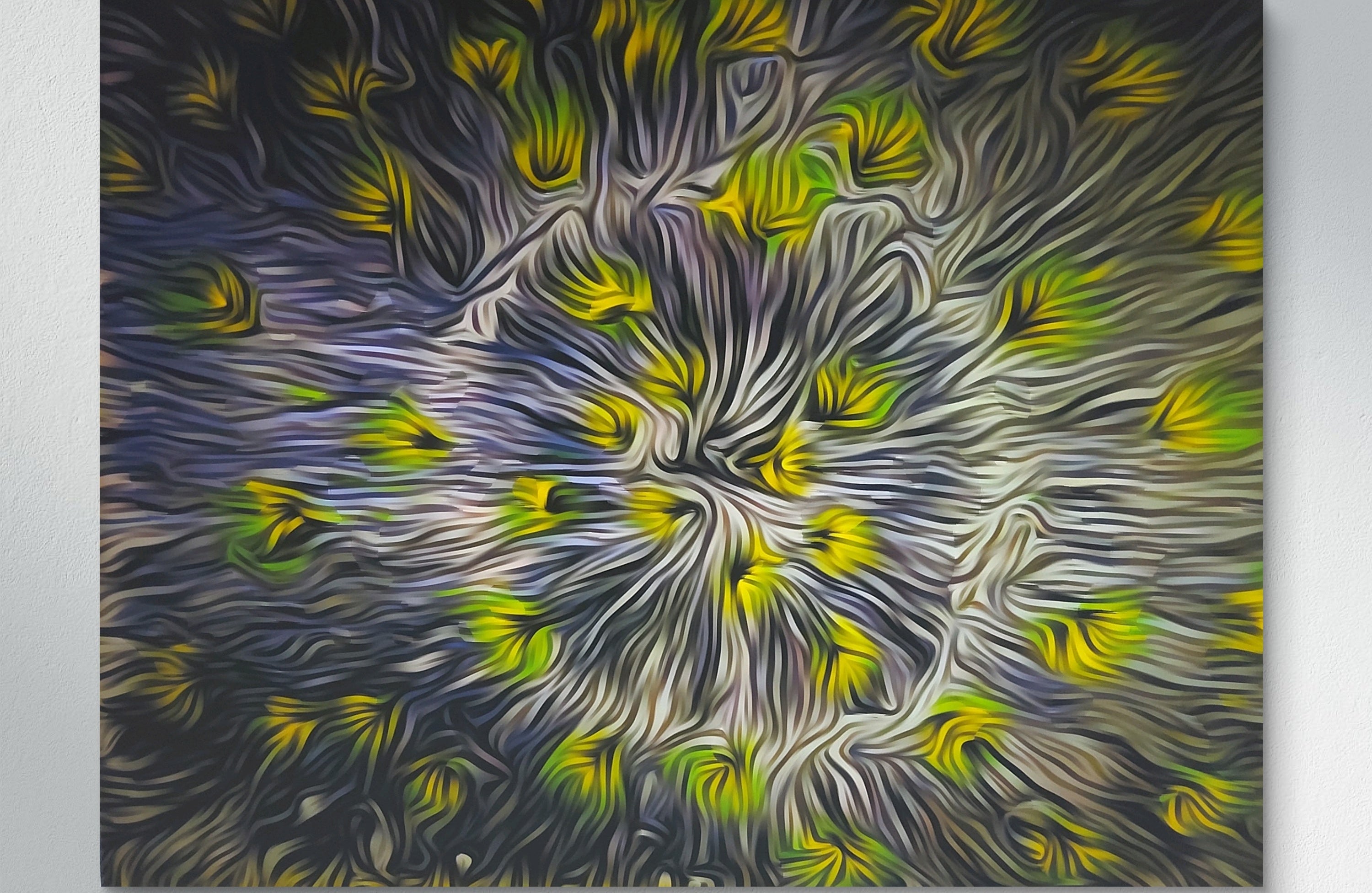 Abstract painting with swirling patterns of blue, green, and yellow on a white wall.